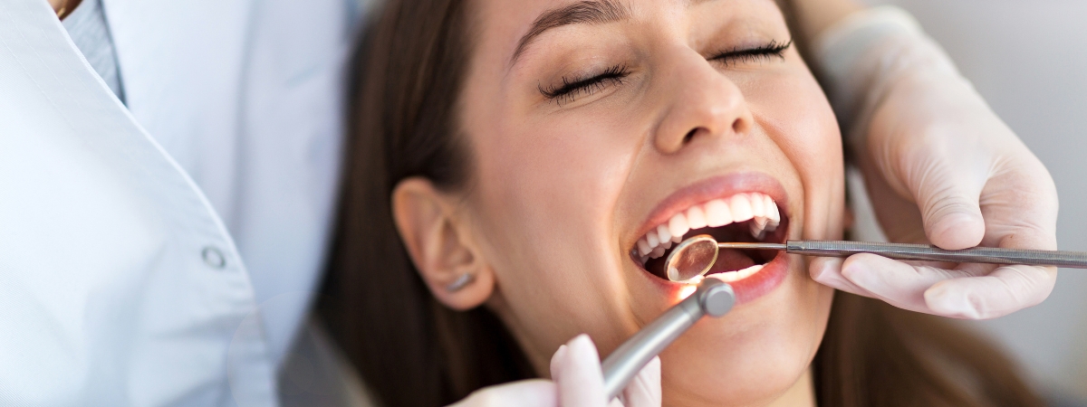 Female patient have her teeth checked