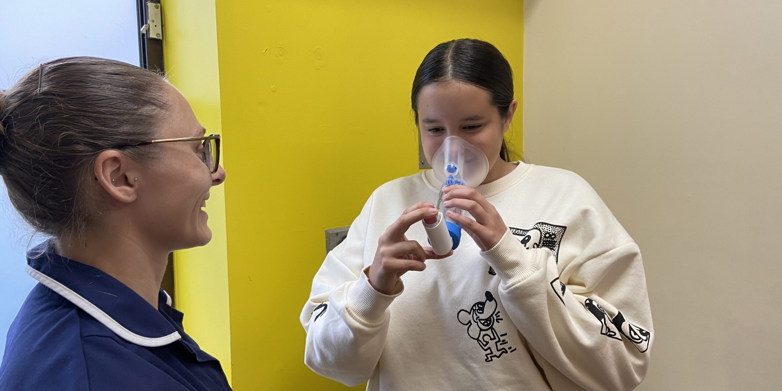 Lauren - Children's Respiratory Nurse with young person using aerochamber spacer