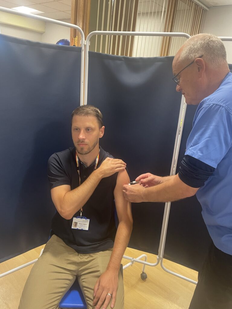 Steve Clapton receiving his COVID-19 vaccination