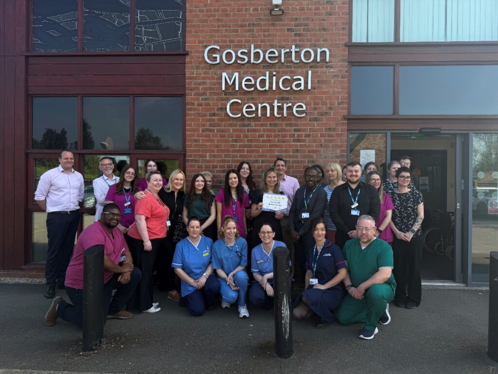 A photo of staff members in front of Gosberton Medical Centre
