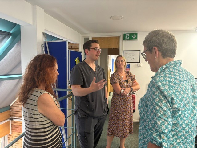 Photograph of Kathy McLean speaking with Jessica Bawden, Dr Gavin Cattigan and Teri White