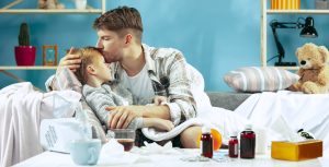 sick-man-with-daughter-home-home-treatment